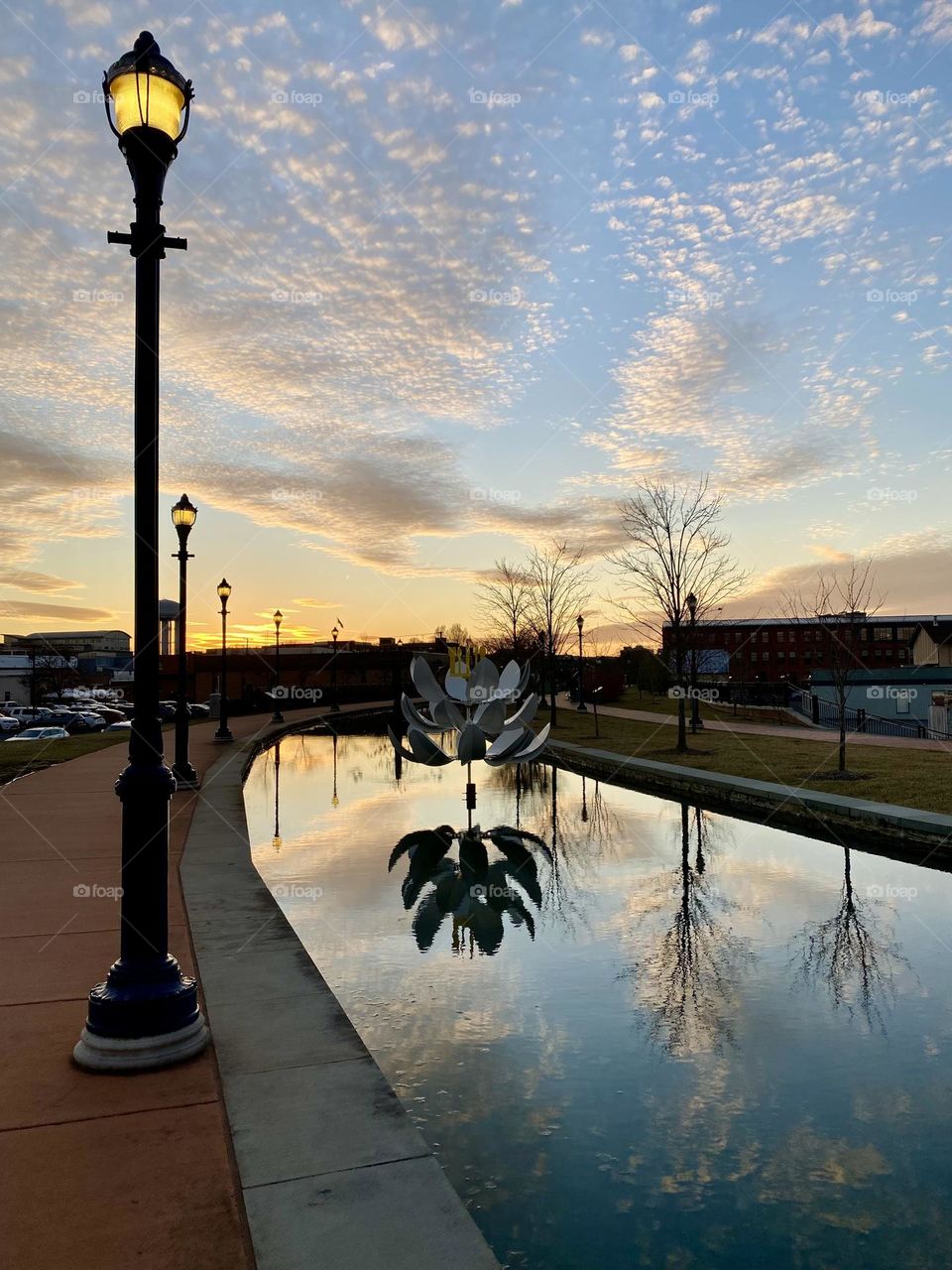 Reflections in the water at sunset on Carroll Creek in Frederick Maryland 