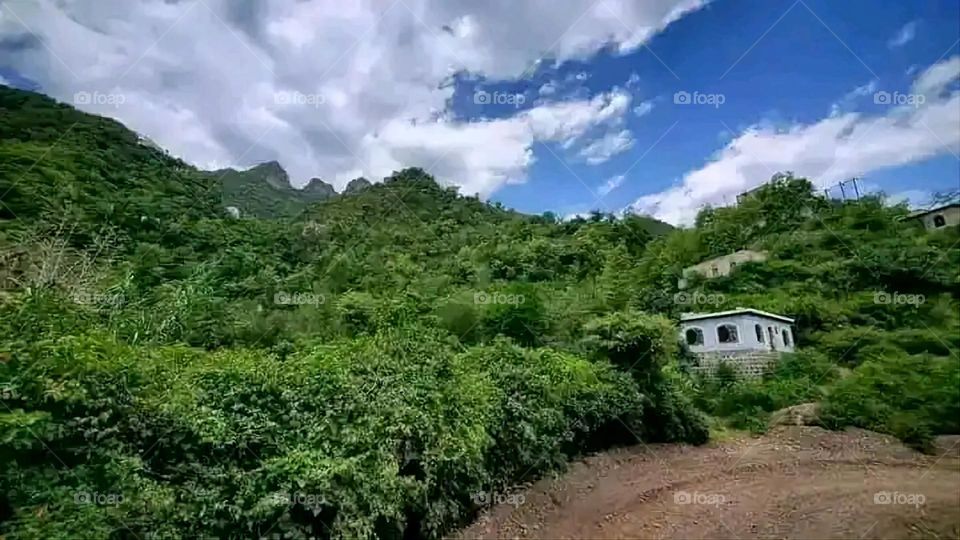 Glory be to God, the magnificent and picturesque view and the natural green trees are a view that is nothing more wonderful than it