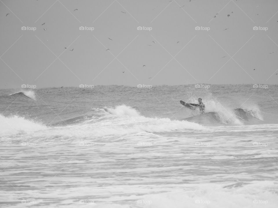 Boogie boarder in the waves.
