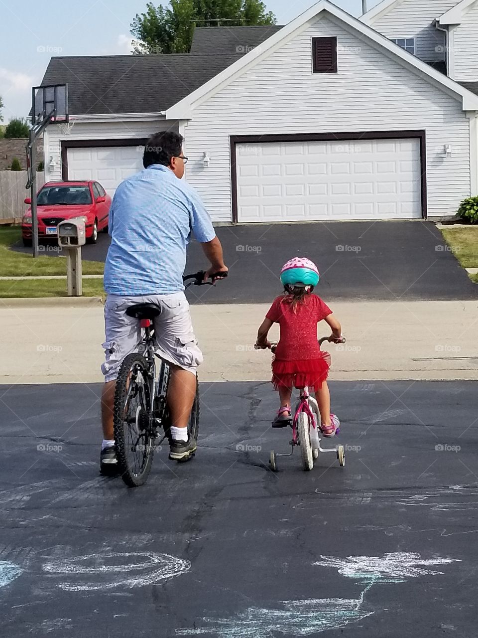 man with child on bike ride