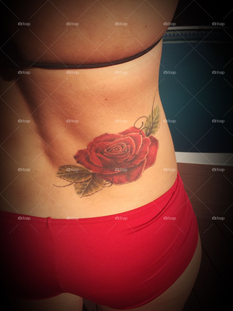 Red rose tattoo. 