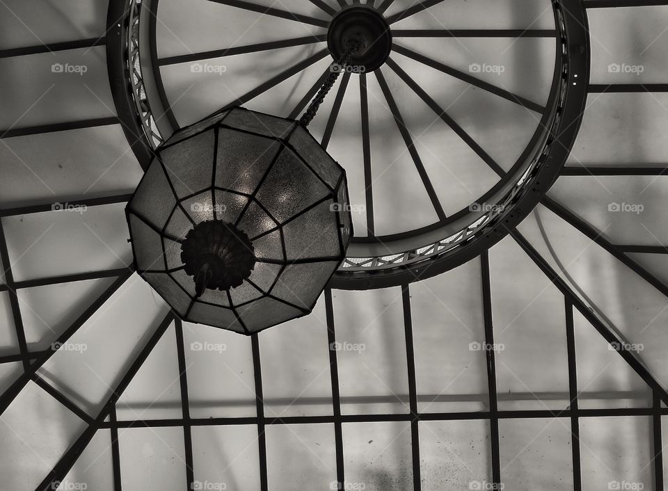 Black And White Architecture. Glass Ceiling With Hanging Light Fixture