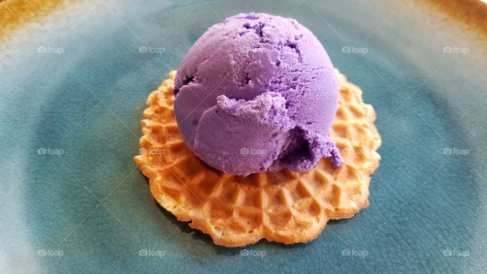 Close-up of ice cream scoop on waffle