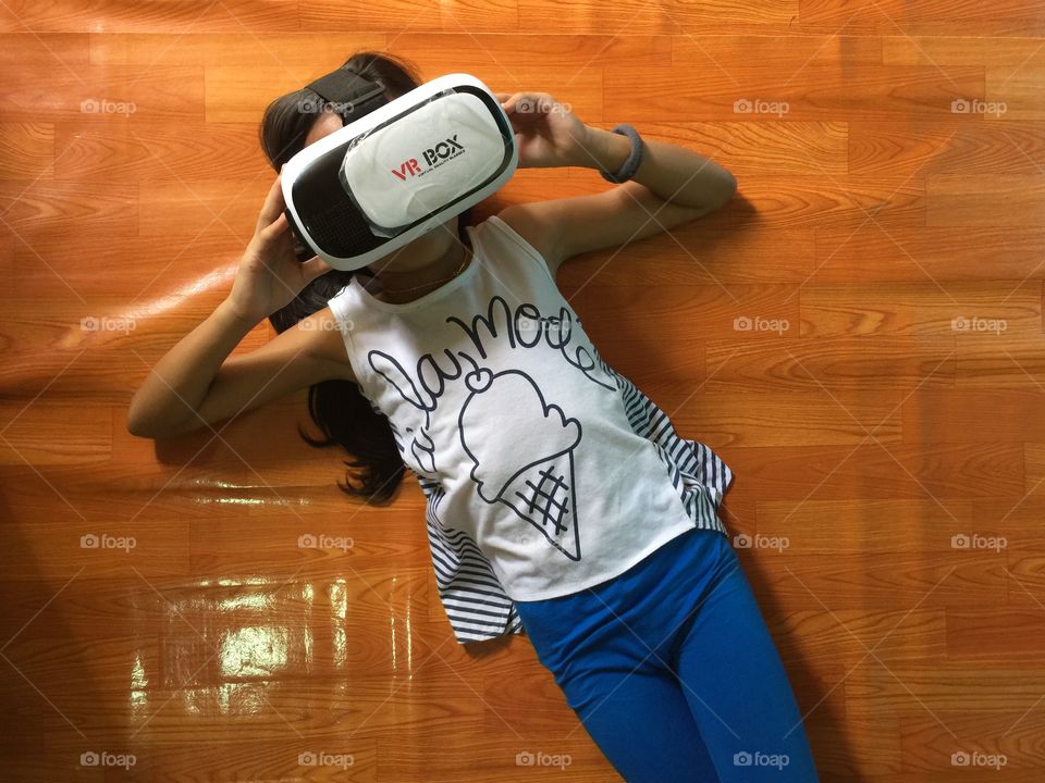 Little girl watching movie vr box