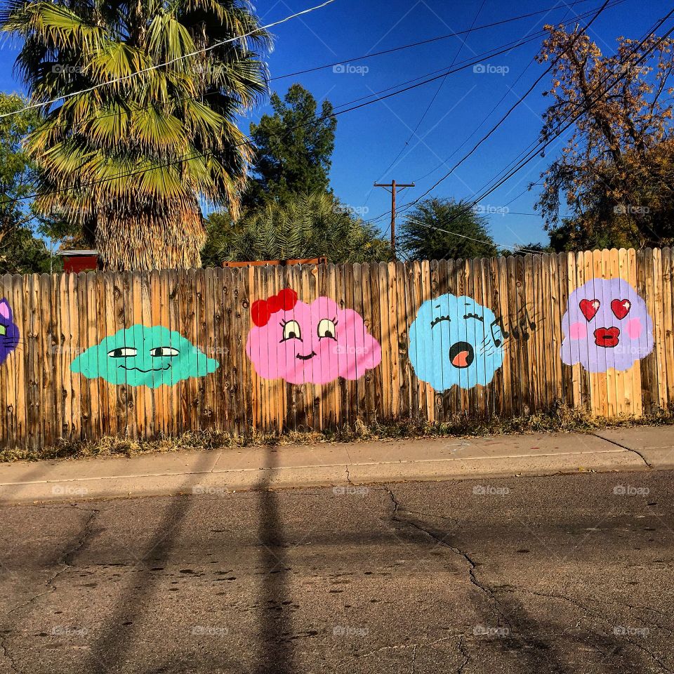 Graffiti on a wood fence.
