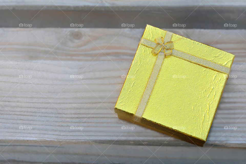 Gift box on wooden background