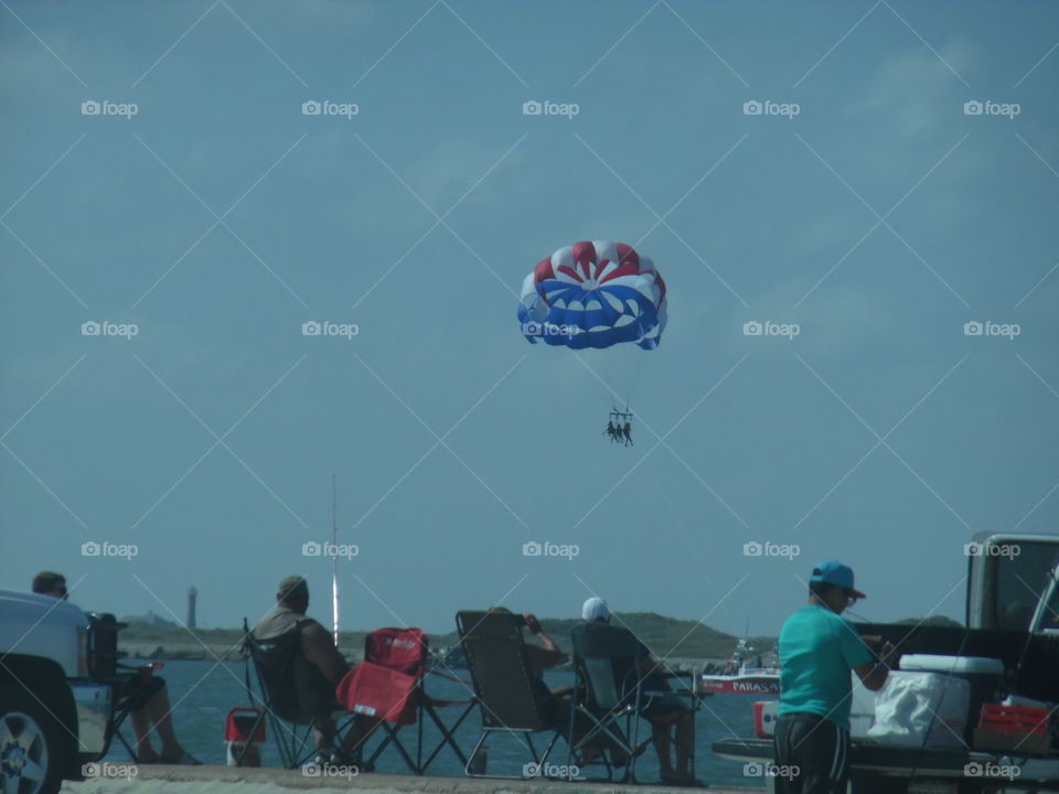 hanging 🔟. This is a picture of a hang glider that I saw while on vacation in the Gulf of Mexico. 👣 🚶 🏃 🔥 💨