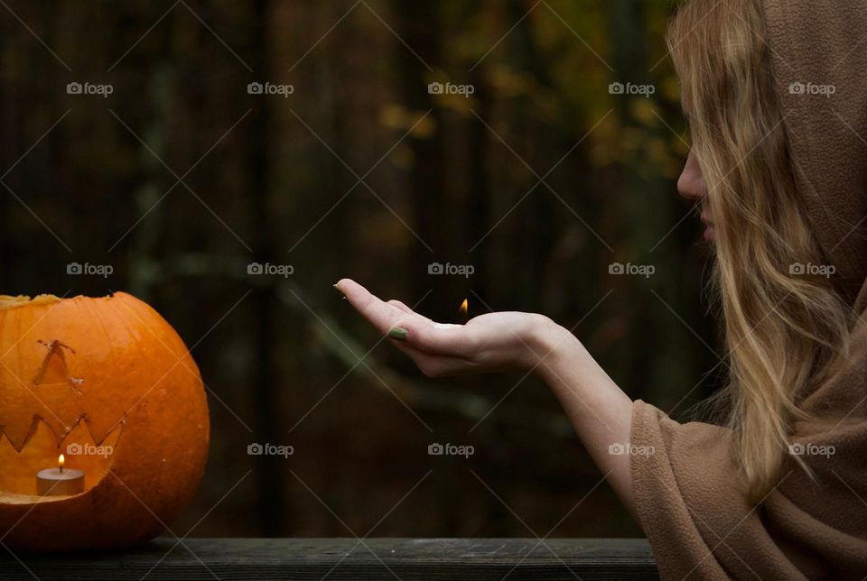 Autumn is Coming; Woman holding the flame 