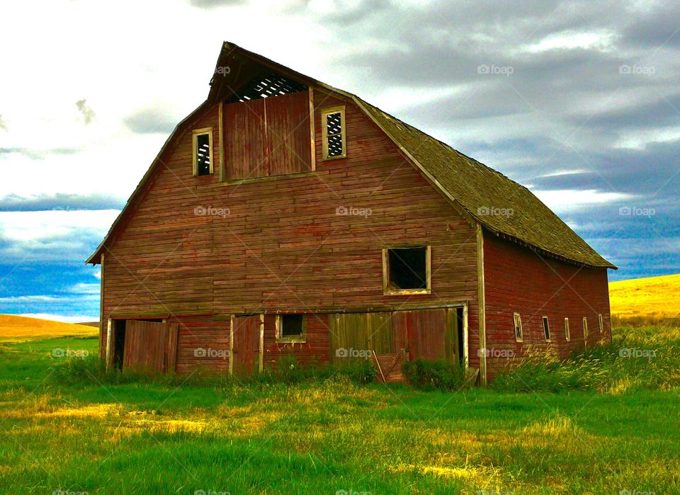 Close-up of a barn against cloudy sky