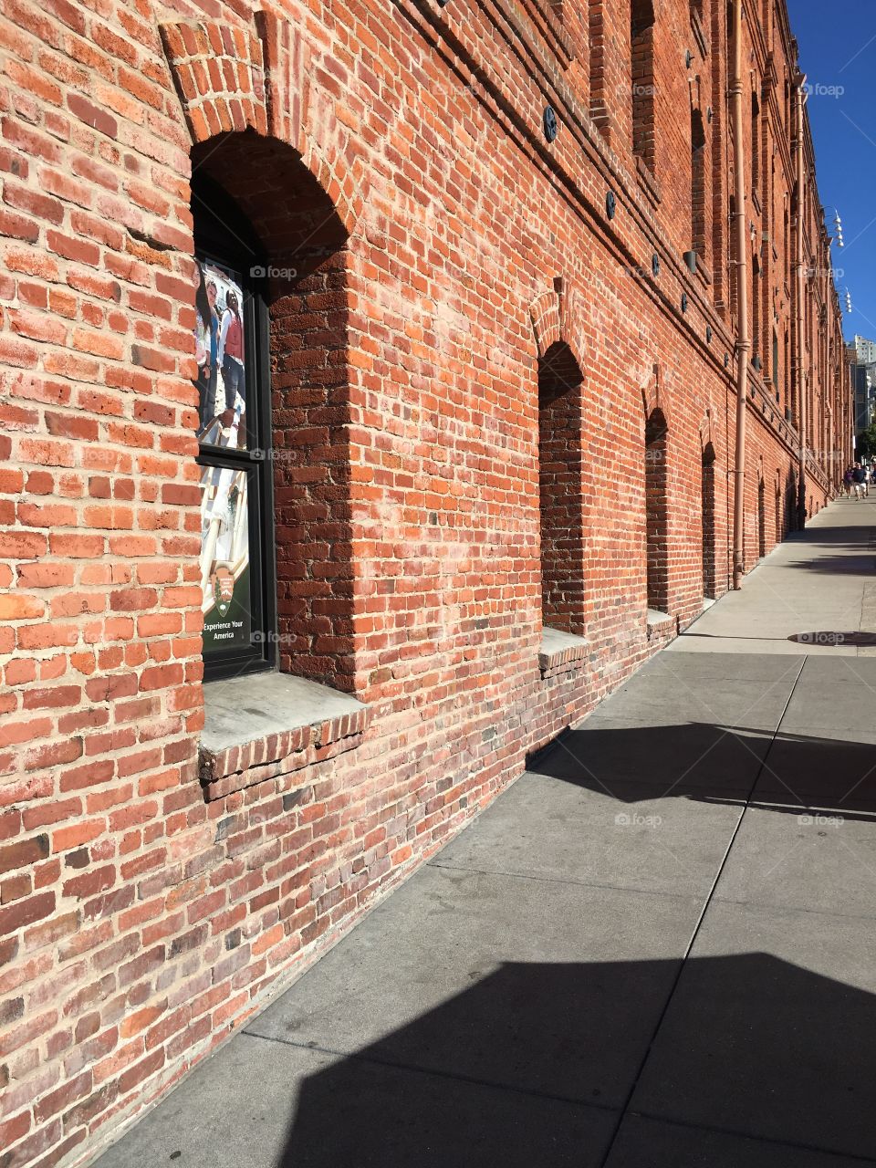 A brick building built into a hill. 