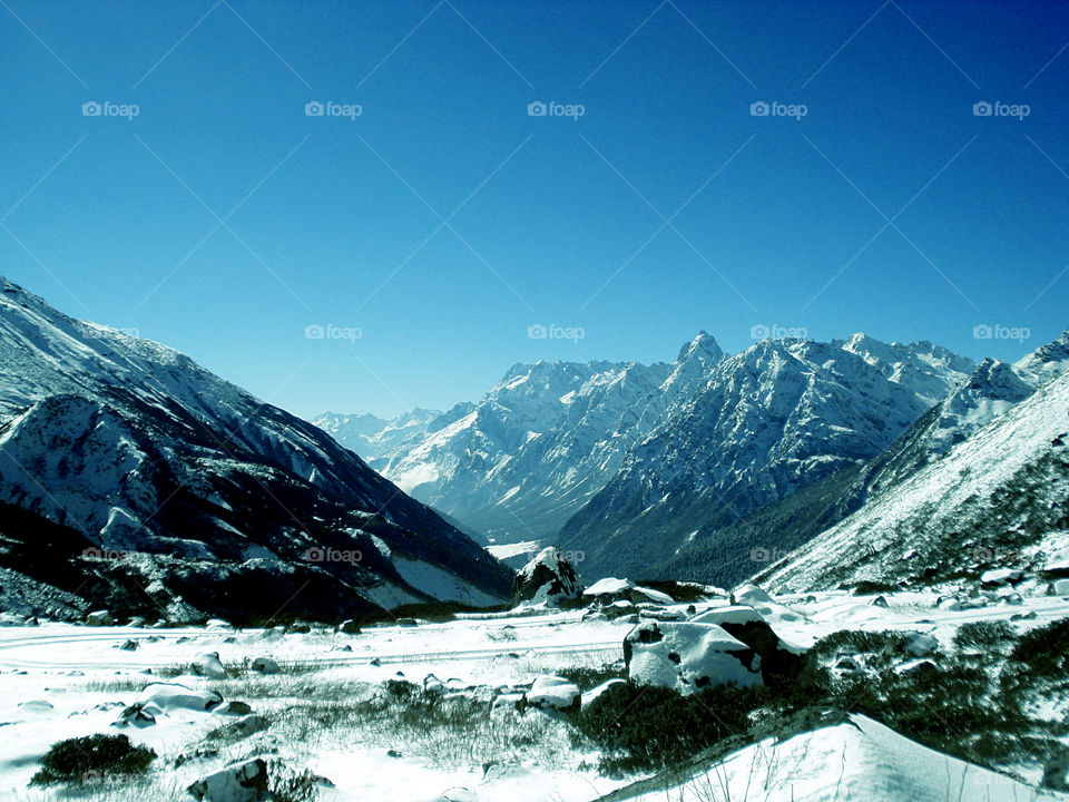 Yumesamdong is situated at the elevation of 15,300 ft. in the Nothern District of Sikkim, India. This place is often called "ZERO POINT" Right at the foothills of the mountains with snow.An amazing view.