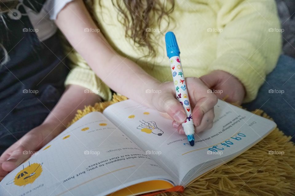 Writing in a Happyself Journal 