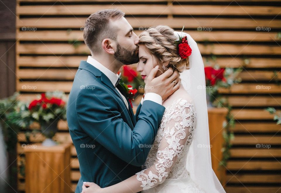 Groom kissing bride. Wedding day