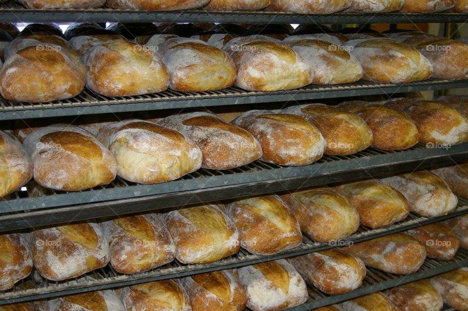 Rack of bread cooling at bakery