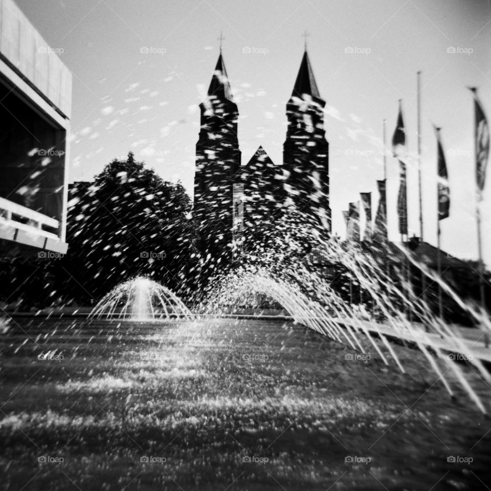 Fountain and buildings in Arnhem, taken with an analog camera, Holga 120. Black and white analog photography