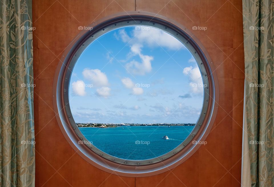 The Bermuda coastline seen the porthole of a cruise ship