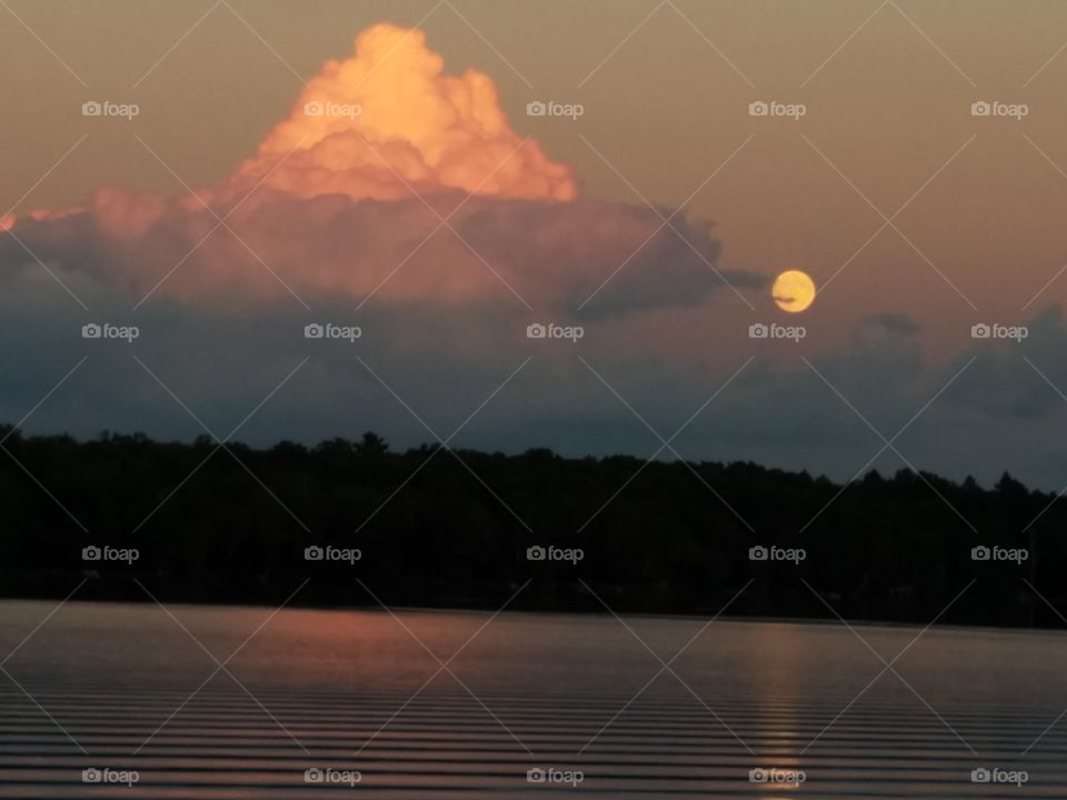 Scenic view of lake at sunset