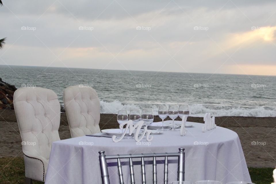 First time Mr and Mrs wedding table at a beach wedding