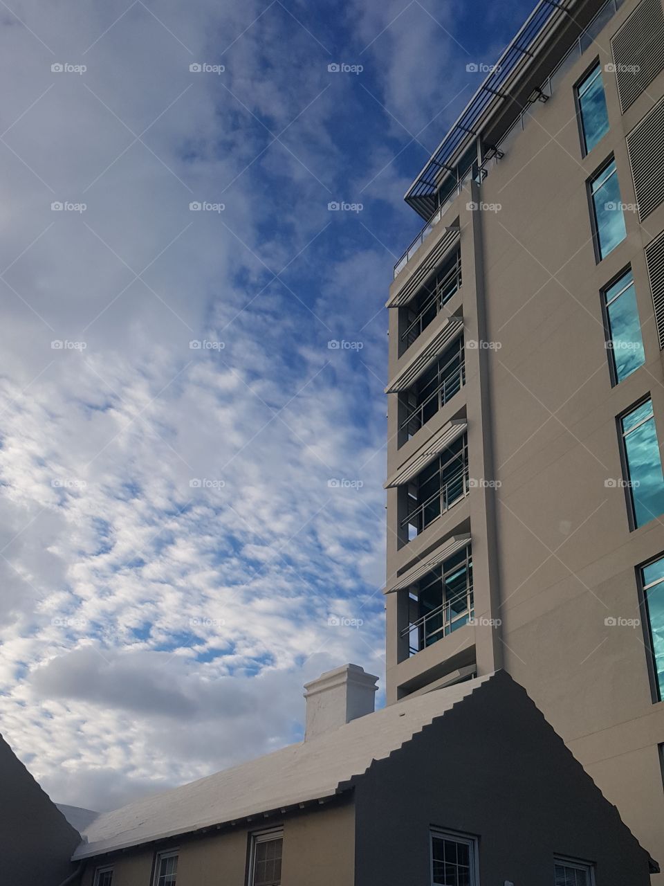 Business building in Bermuda. Architecture VS nature in sky.