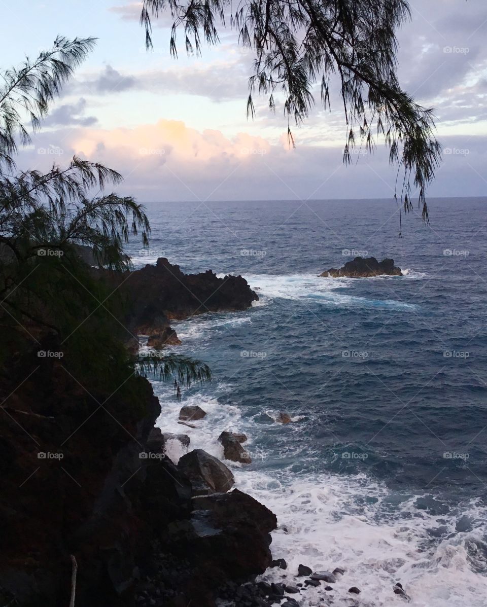 The ocean waves at dusk