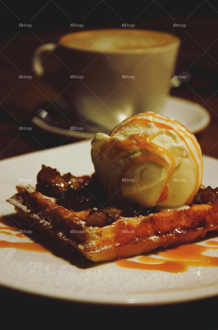 Sweet dessert. Ice-cream with waffle and caramel.