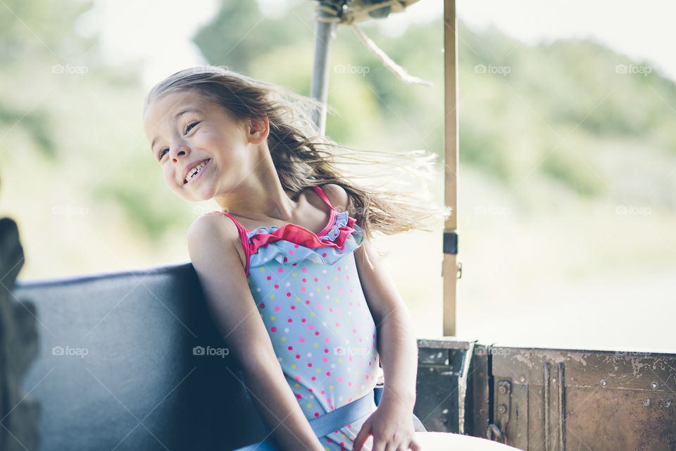 Happy little girl enjoying in park