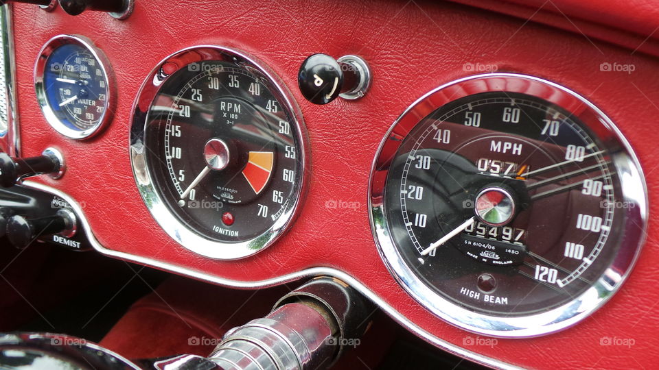 red leather dash broad for a vintage car.