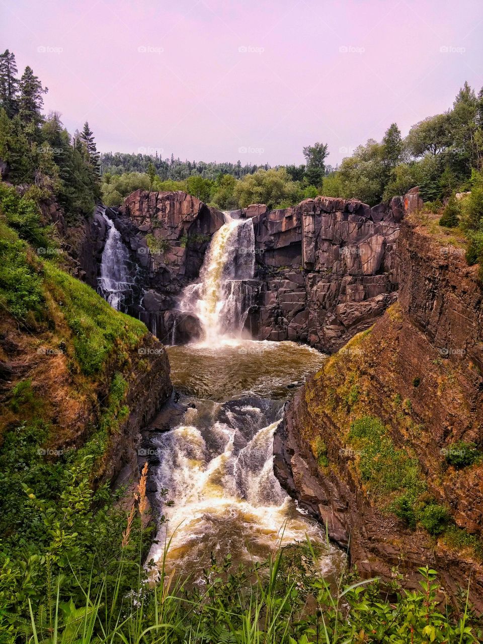 Waterfall on the Border of Minnesota and Canada. A wonderful place to photograph. The amount of Water flowing often changes. Flow of water can range from a slow trickle to water running down all sides.