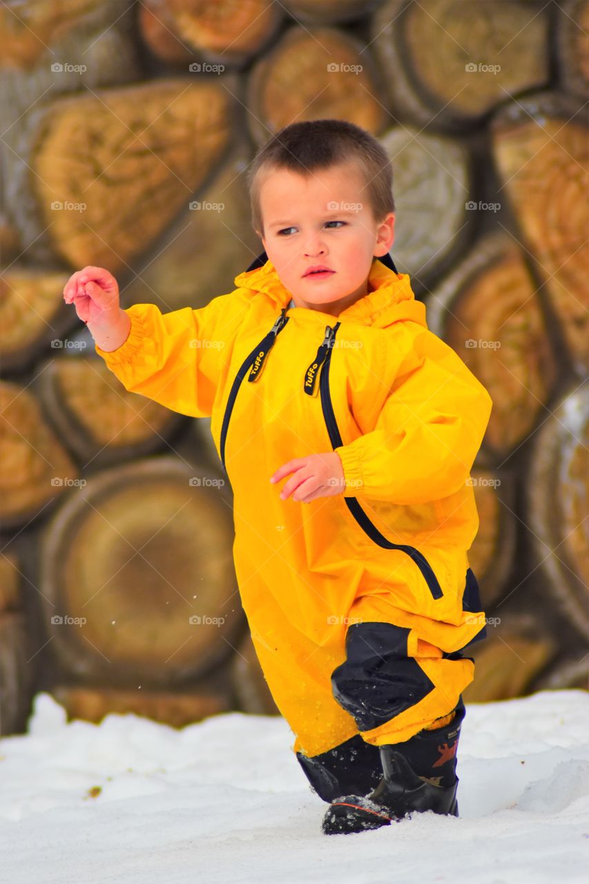 toddler with rain gear