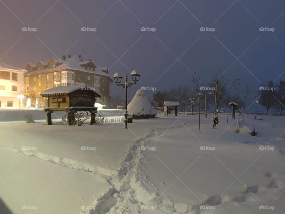 Beautiful sunset background in Riaño covered with snow