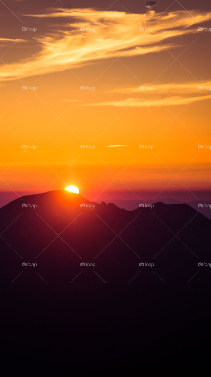 An inspiring purple mountain landscape. Tatry mountains in Slovakia. A beautiful wallpaper for smartphone screen. Purple abstract gradient with perspective.