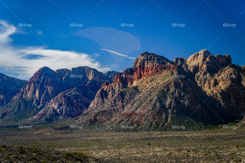 Red Rock Canyon Las Vegas, NV. Landscape of Red Rick Canyon in Nevada with bright blue sky and clouds. 