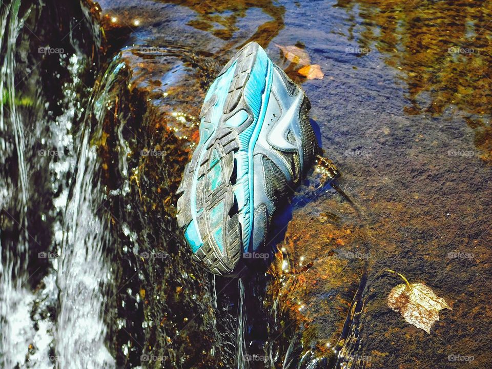 Someone lost a shoe on a waterfall