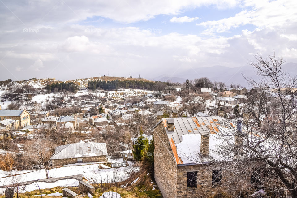 Traditional Snowy Village Nimfaio In Greece At Winter
