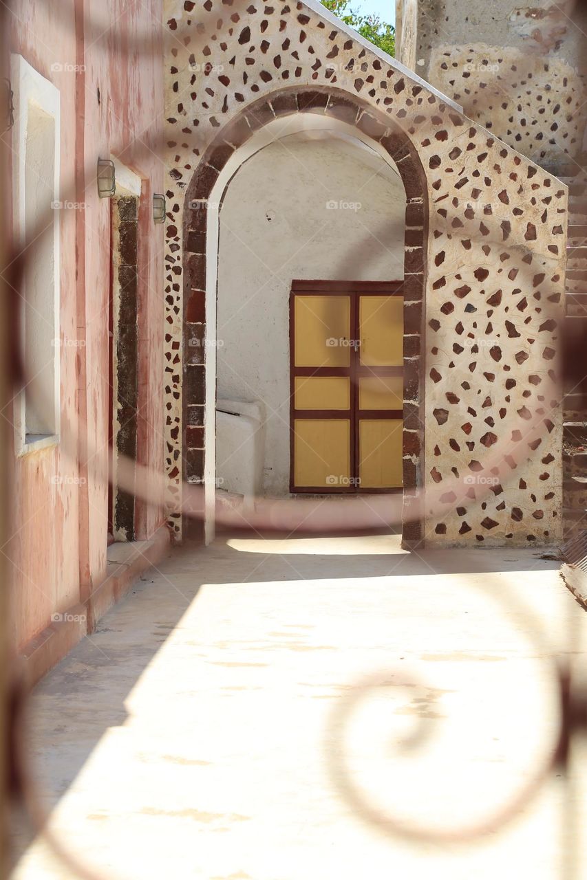 Architectural photo of an wall made of stones in decorative shapes