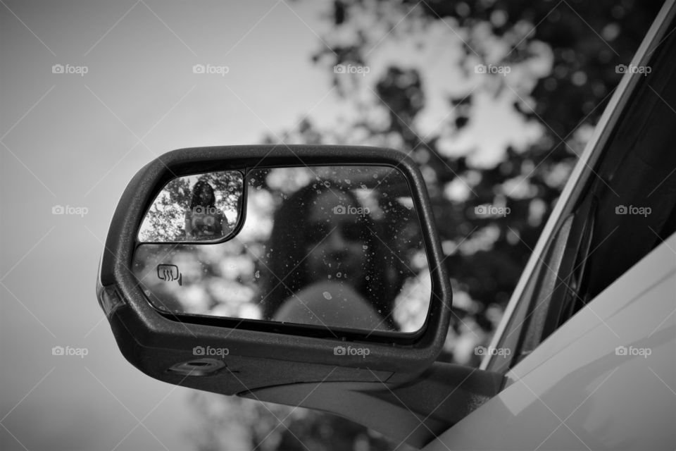 Reflection on car's mirror