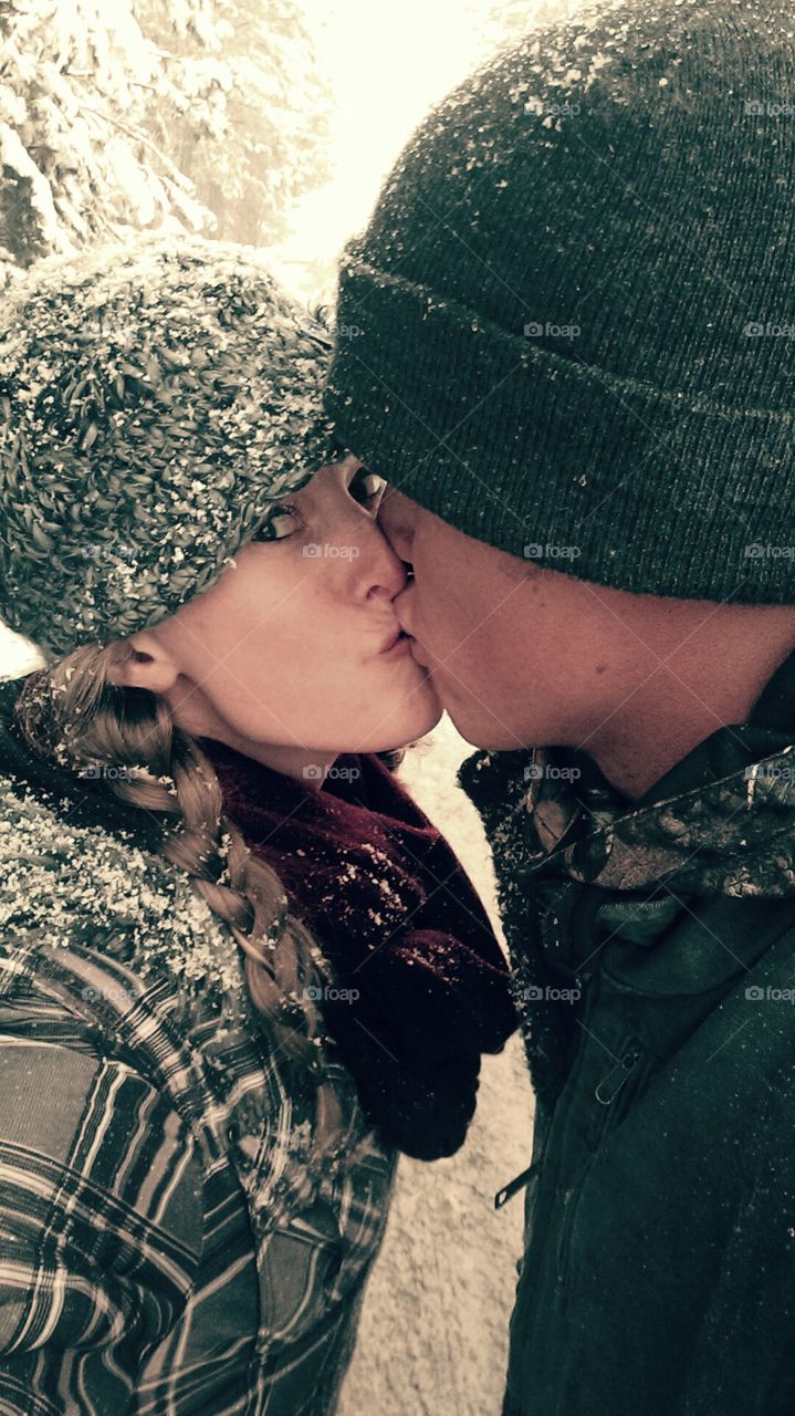 On a snowy day!. Kissing in the beautiful snow!