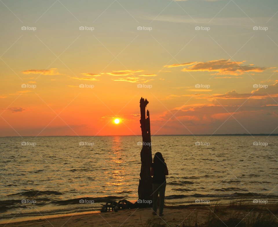 Observing the sunset on the beach