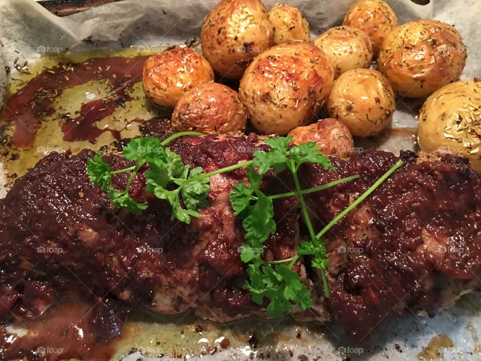 Quince encrusted pork tenderloin with rosemary infused roasted creamy white baby potatoes