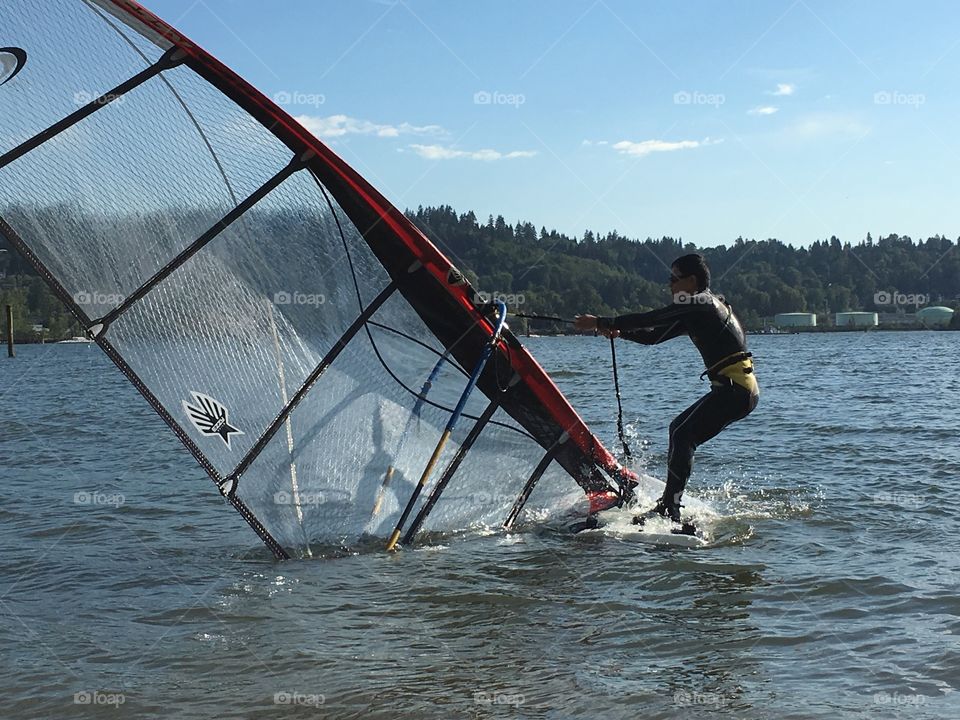 Man windsurfing in harbour ocean near Vancouver 