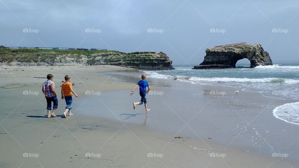 Boys Running at the Beach