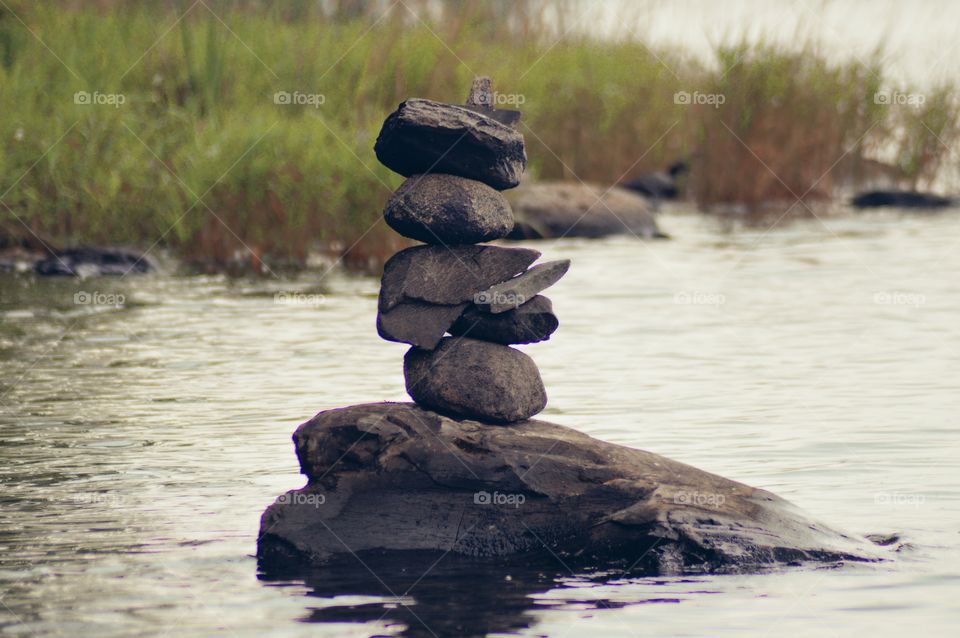 Cairn in a Maine lake at dusk