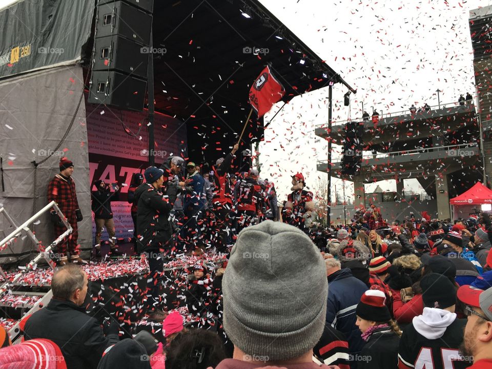 Confetti falls over a crowd during a CFL Redblacks celebration at TD Place at Lansdowne Park in Ottawa, Ontario. 2016.
