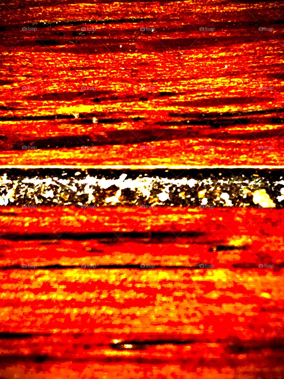 An abstract photograph of colors, values, patterns and texture combined to give an unique feeling of warmth. Its composition would allow viewers to develop their own interpretations of what goes on in the image.