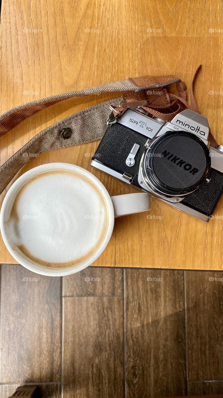 I always take my film camera with me when I’m going on vacation. And a cup of coffee is a must!