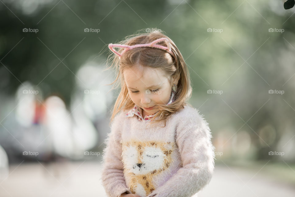 Cute Little girl in a blossom park