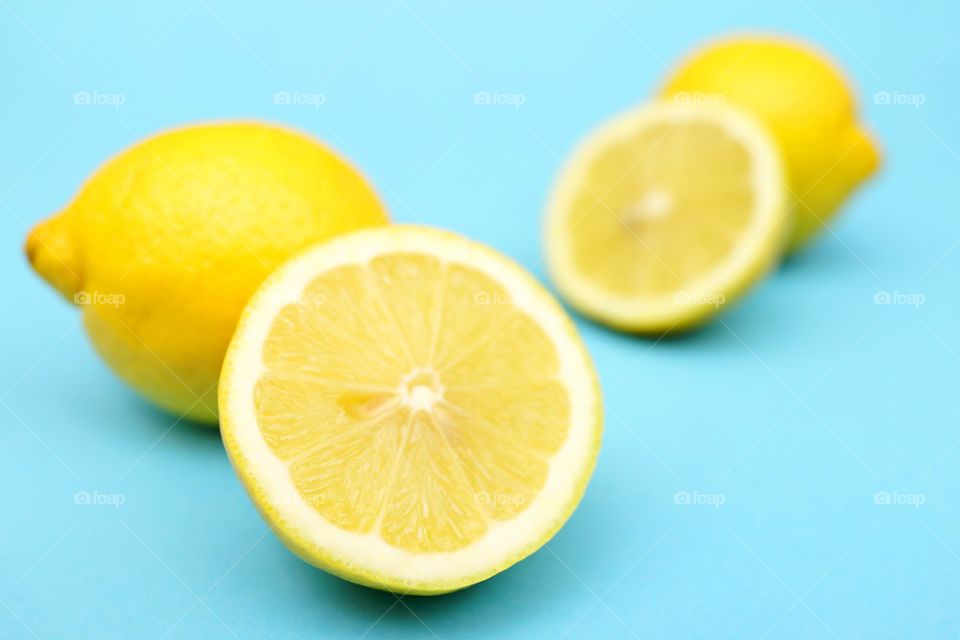 Sliced lemon on blue background