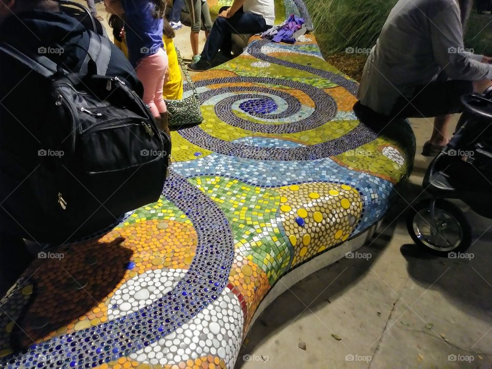 Mosaic tile art outdoor seating in the city