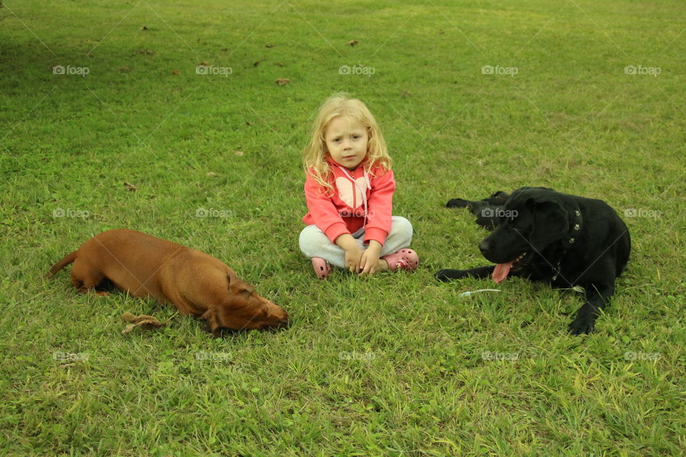 girl with two dogs