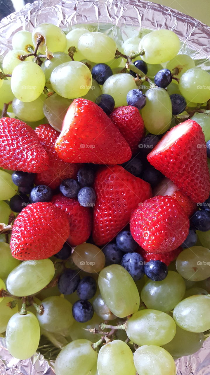 strawberries grapes and blueberries